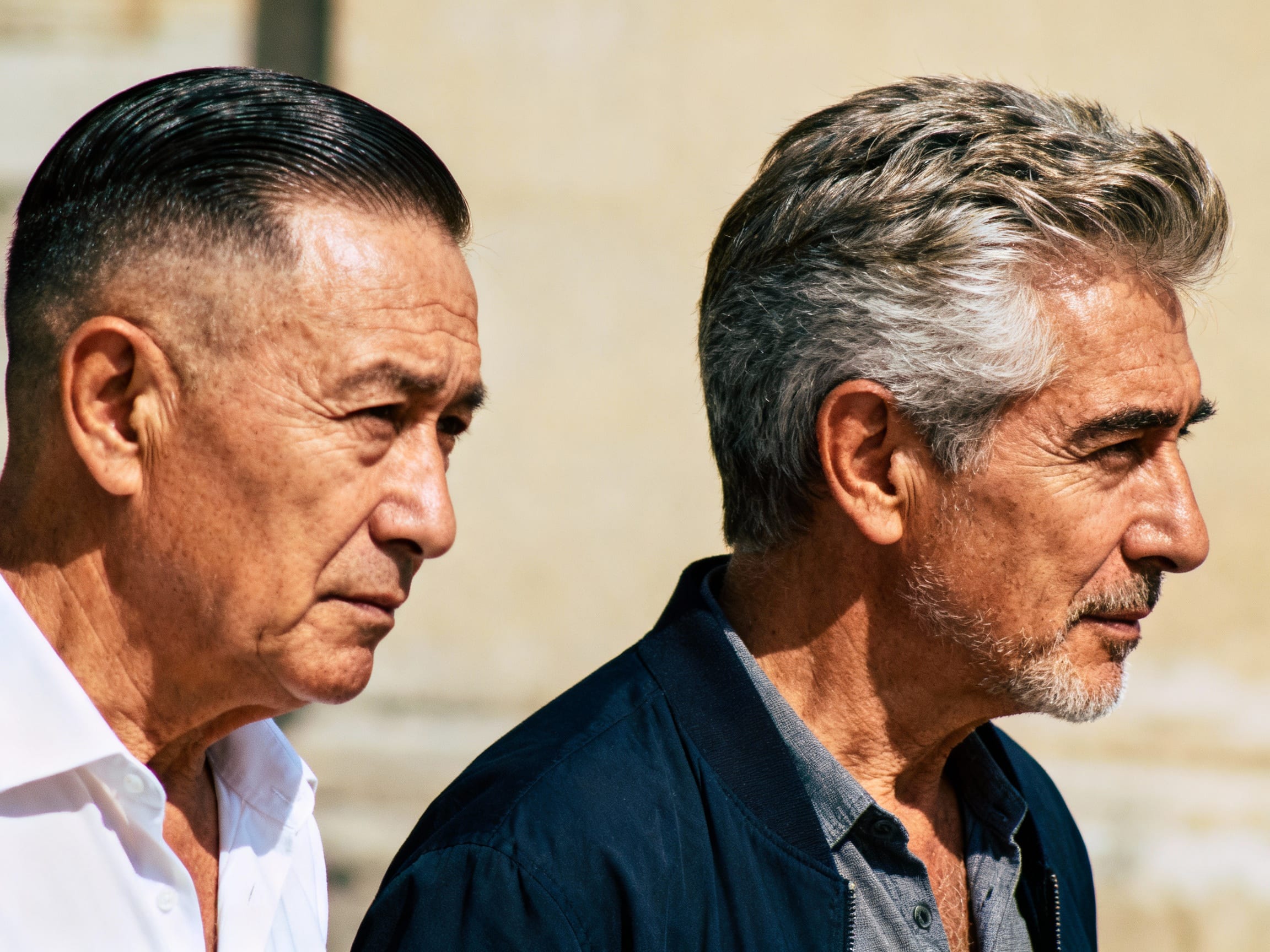 older man with uninspired haircut next to stylish older man