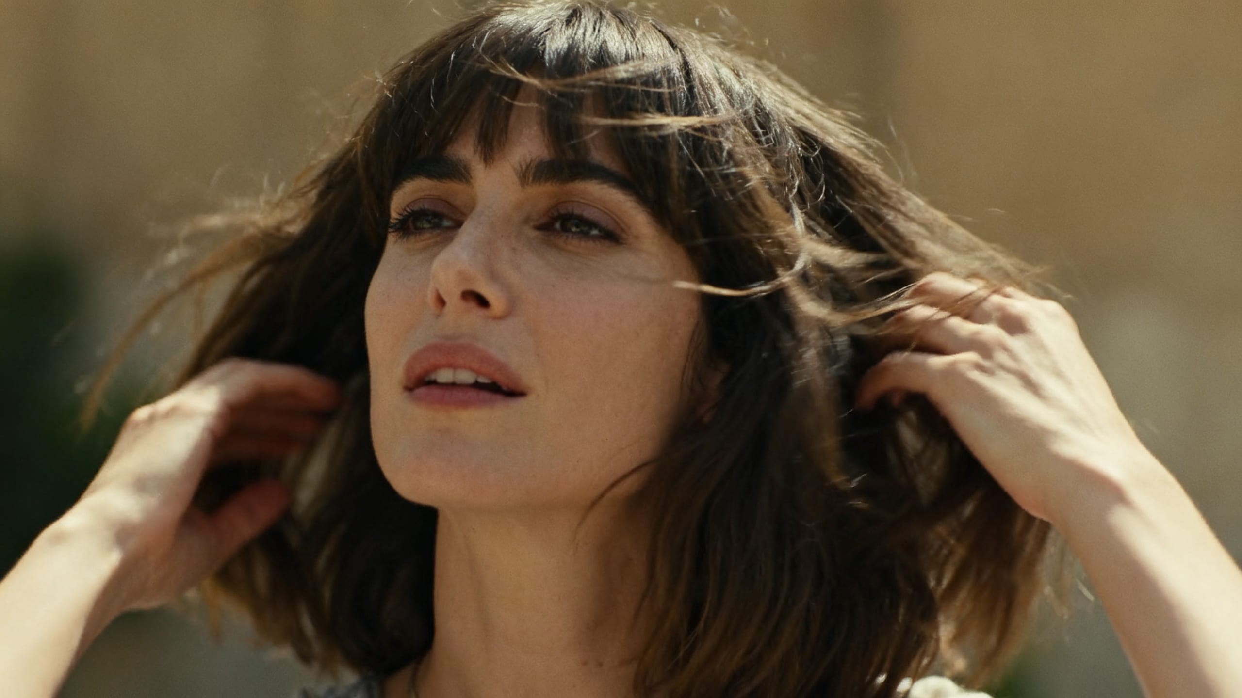 woman quickly styling medium length hair