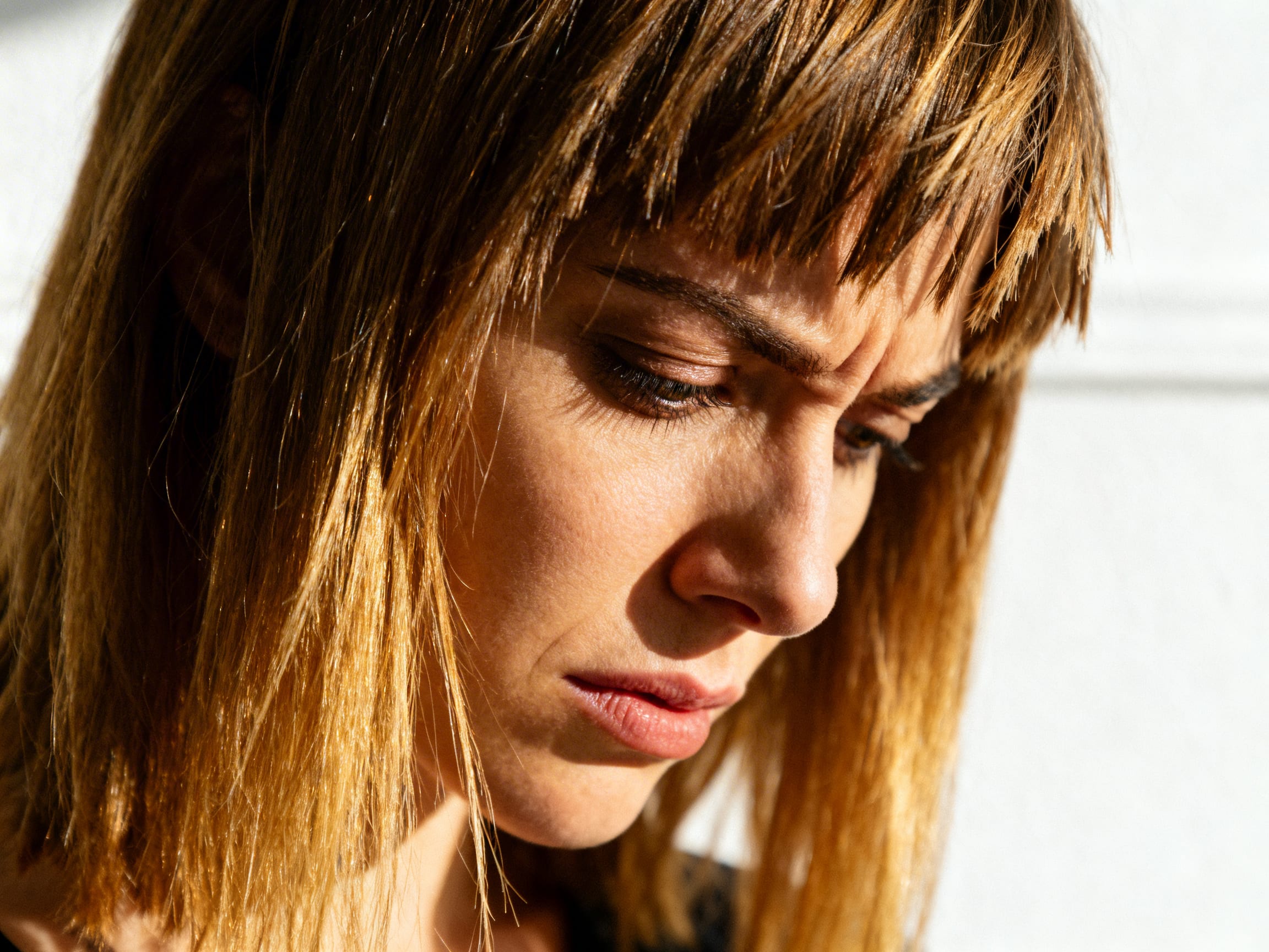 woman looking disappointed with a bad haircut
